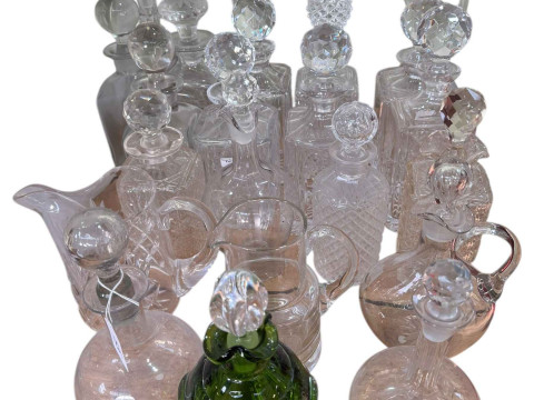 Collection of glass decanters, claret jug, green glass, etc.