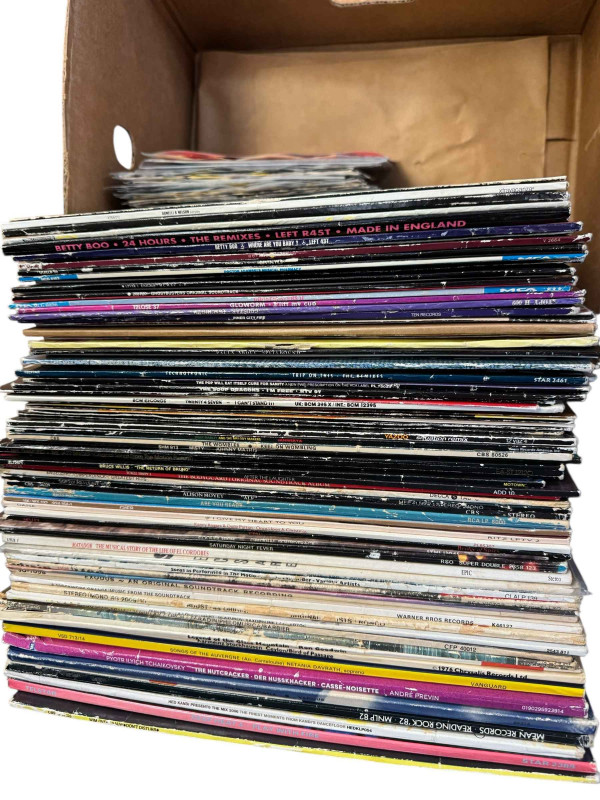Four boxes of LP records.
