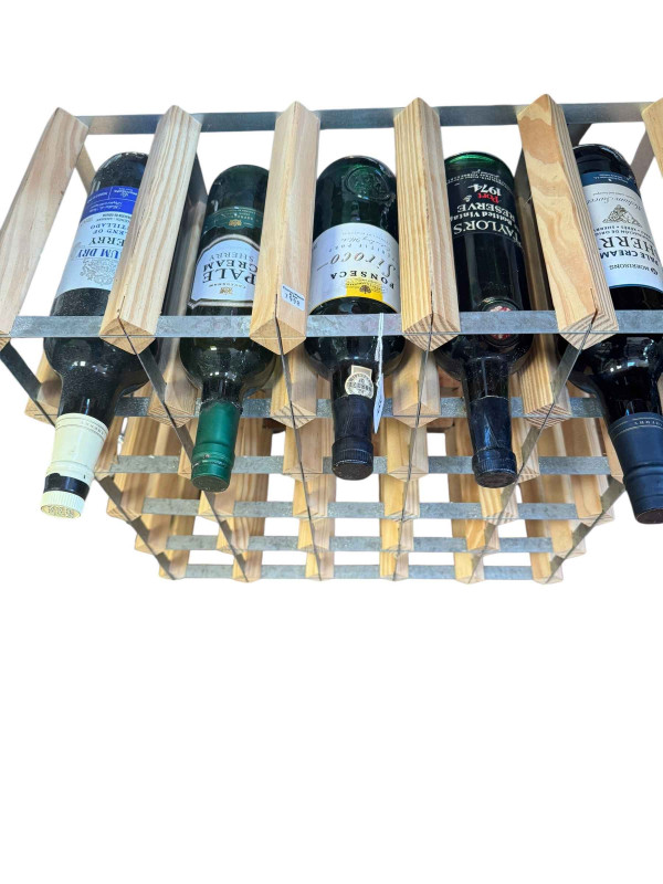 Wine rack housing five bottles of spirits including Sherry and Port.