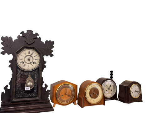 Four mantel clocks and a gingerbread clock.
