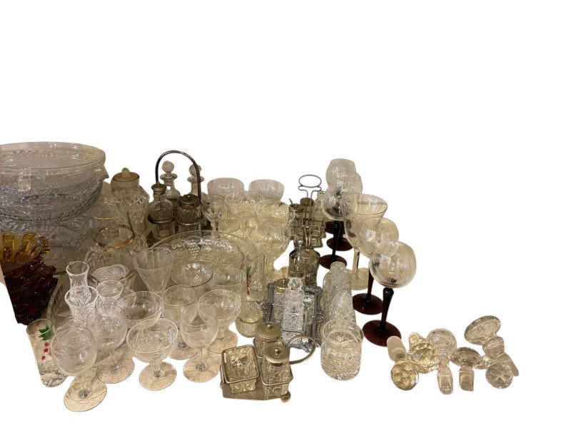 Large collection of glass including cruet sets, decanter stoppers, etc.
