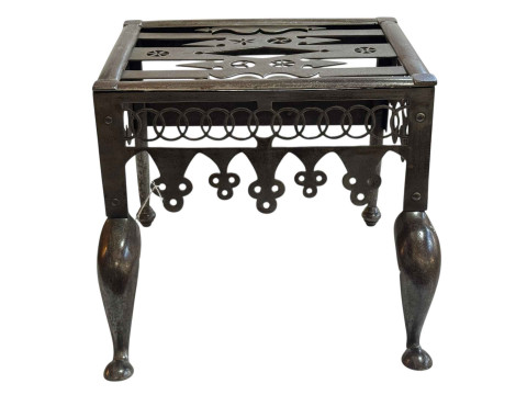 Ornate steel footman, 32cm high.