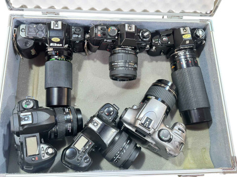 Case of cameras including five Nikon, Canon, etc.
