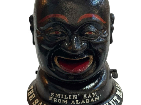 Novelty cast iron peanut dispenser.