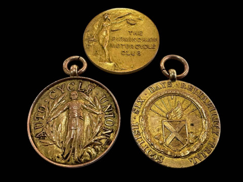 Three 9 carat gold motoring interest medallions.