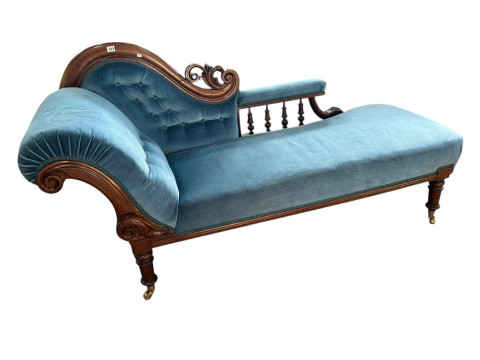 Victorian mahogany framed chaise longue in blue buttoned fabric.