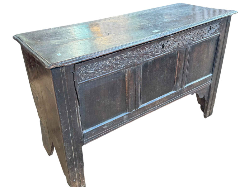 Antique carved oak triple panel front kist, 68cm by 106cm by 41cm.