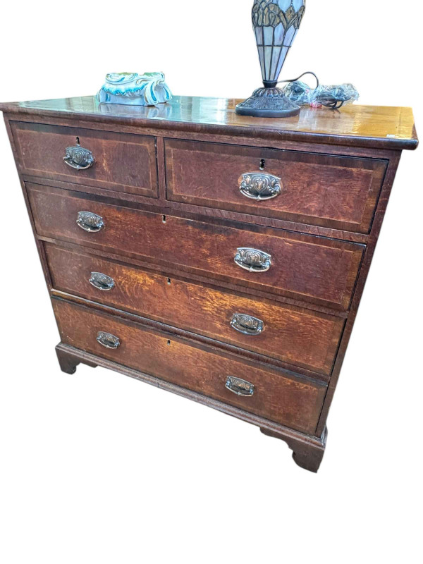 Victorian oak and mahogany crossbanded chest of two short above three long graduated drawers on bracket feet, 101cm by 105cm by 55cm.