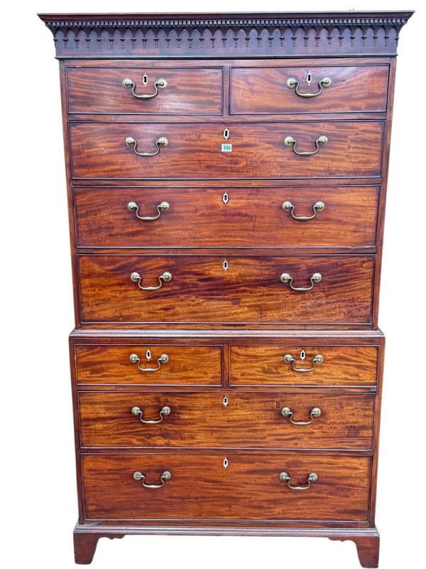 George III mahogany chest on chest having dentil cornice above two short and three long graduated drawers on a base of two short above two long graduated drawers on bracket feet, 187cm by 110.5cm by 52cm.