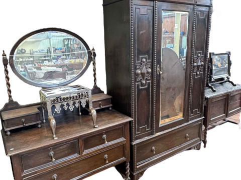 1920's oak Jacobean style four piece bedroom suite comprising mirror door...