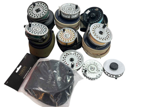 Collection of assorted fishing reels including Hardy.