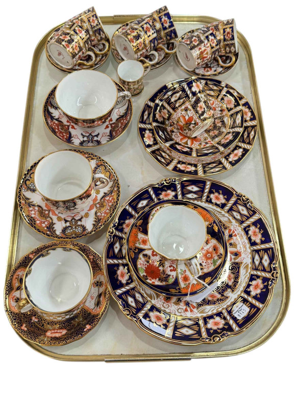 Collection of Royal Crown Derby cups and saucers and plates.
