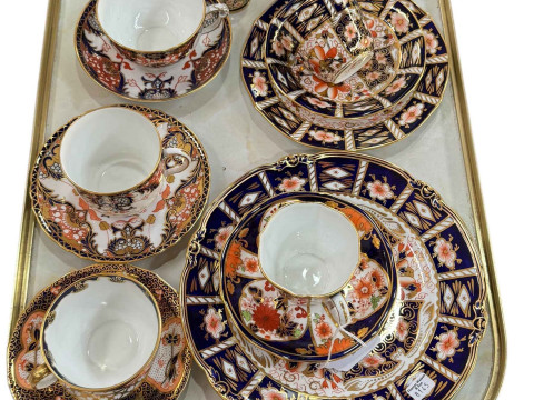 Collection of Royal Crown Derby cups and saucers and plates.