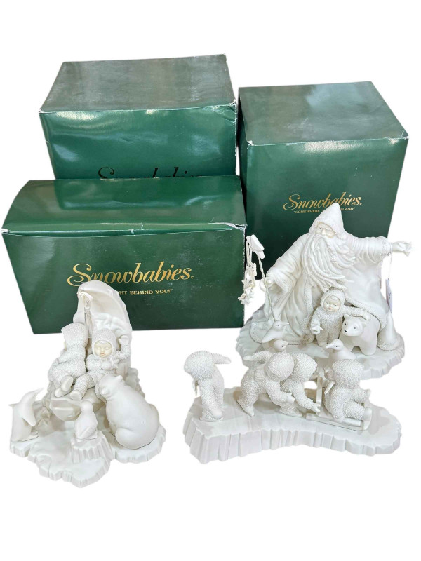Three boxed Snow Babies festive ornaments.