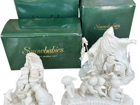 Three boxed Snow Babies festive ornaments.