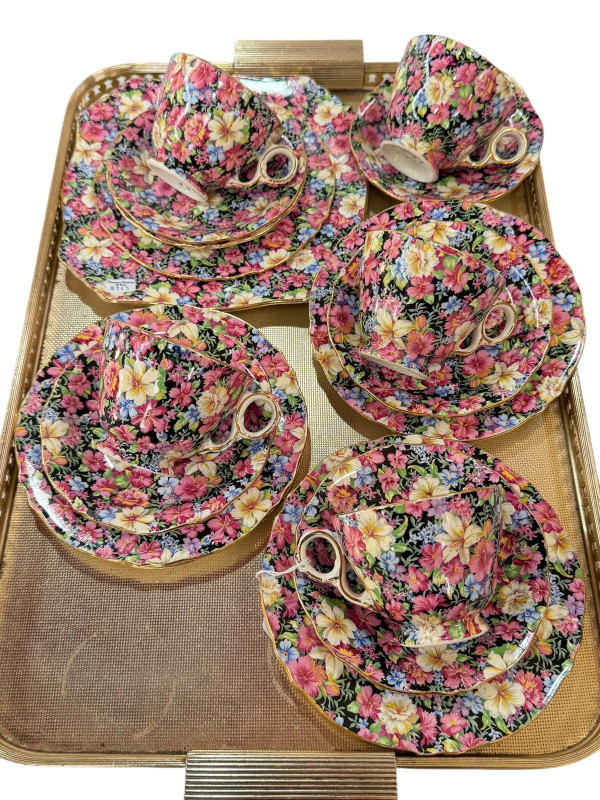 Set of five Royal Winton Chintz pattern cups and saucers, and sandwich plate.