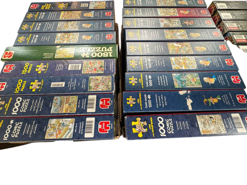 Three boxes of Wasgij puzzles, Original, Mystery and Christmas, and two boxes of Jan Van Haasteren comic jigsaw puzzles.