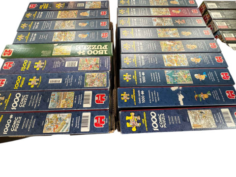 Three boxes of Wasgij puzzles, Original, Mystery and Christmas, and two boxes of Jan Van Haasteren comic jigsaw puzzles. thumbnail