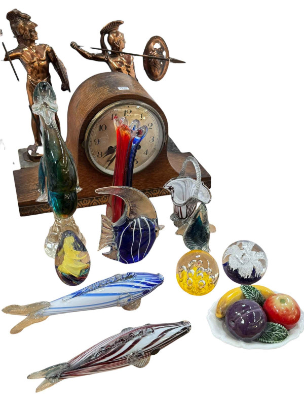 Oak mantel clock, two Roman soldier figures and collection of glass including paperweights and fish.