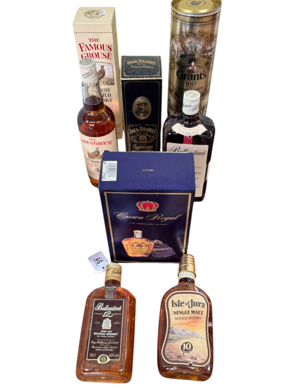 Eight assorted bottles of whisky including Jack Daniels, Ballantines and Isle of Jura.