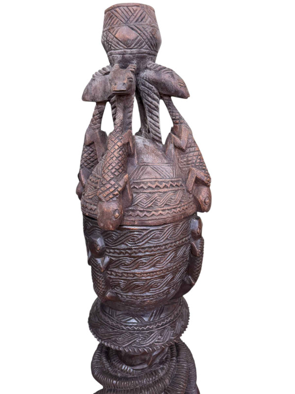 West African tribal art large carved wood three tier vessel and cover, carved and stylised with snakes, antelopes and lizards from Mali, 160cm.