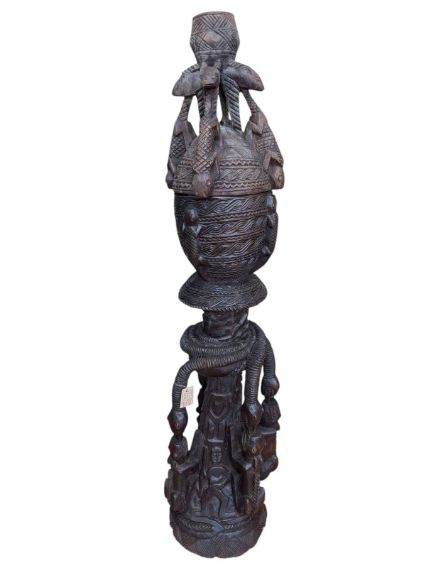 West African tribal art large carved wood three tier vessel and cover, carved and stylised with snakes, antelopes and lizards from Mali, 160cm.