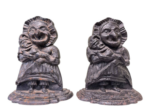 Two late Victorian cast iron doorstops modelled as Judy and Baby.