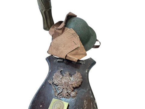 WWI steel helmet, gas mask bag dated 1916, eagle shield, shell case and...