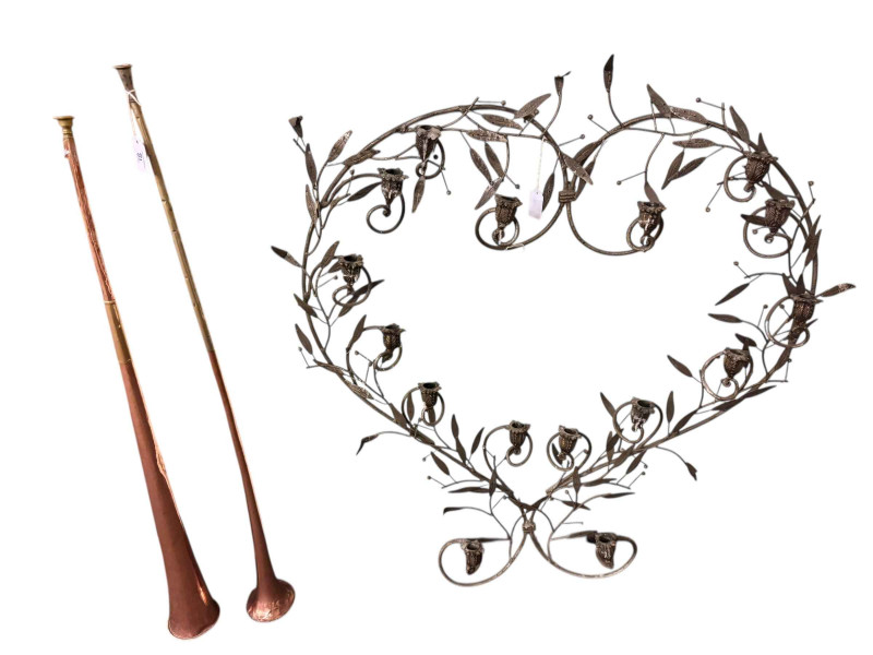 Two copper coaching horns, ironwork candle display, brass coal box, wall sconces, letter box and brassware.