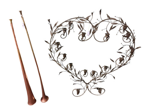 Two copper coaching horns, ironwork candle display, brass coal box, wall sconces, letter box and brassware. thumbnail