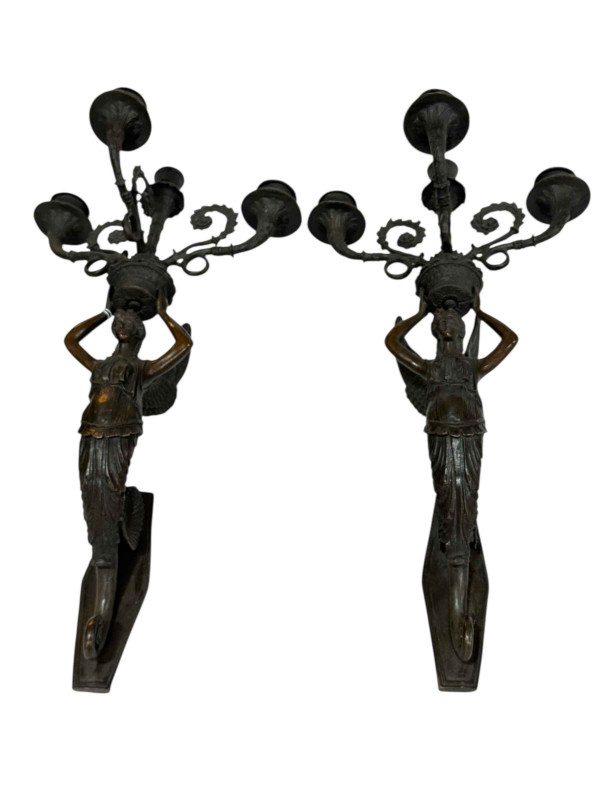 Pair bronze winged figural wall mounted candelabra, 49cm.