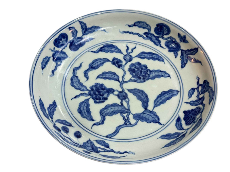 Chinese blue and white charger with flowering branch decoration, 30cm diameter.