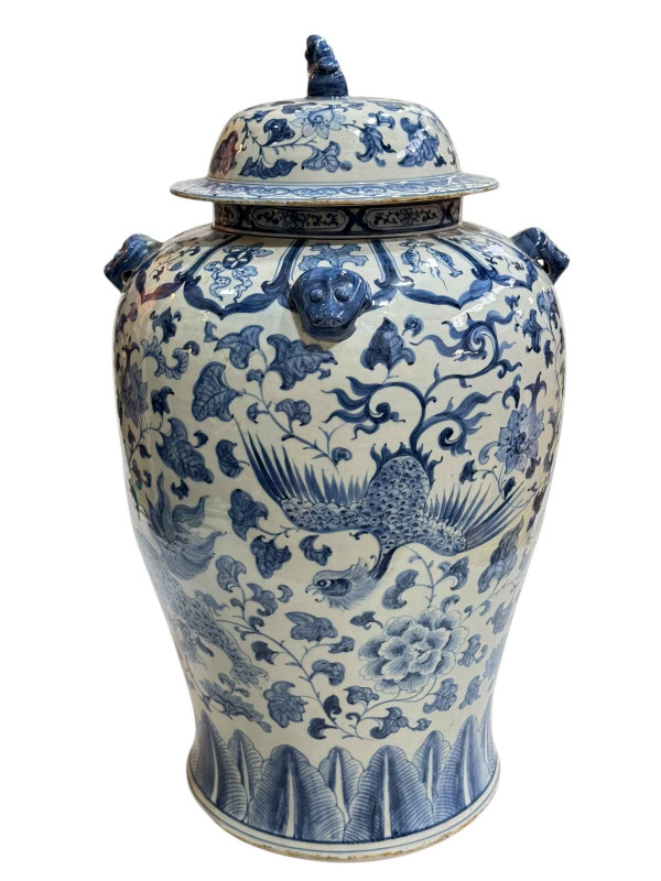 Large Chinese blue and white porcelain vase and cover decorated with Phoenix and Dragons, the lid mounted with dog of fo, 60cm.