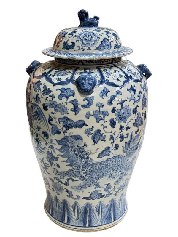 Large Chinese blue and white porcelain vase and cover decorated with Phoenix and Dragons, the lid mounted with dog of fo, 60cm.