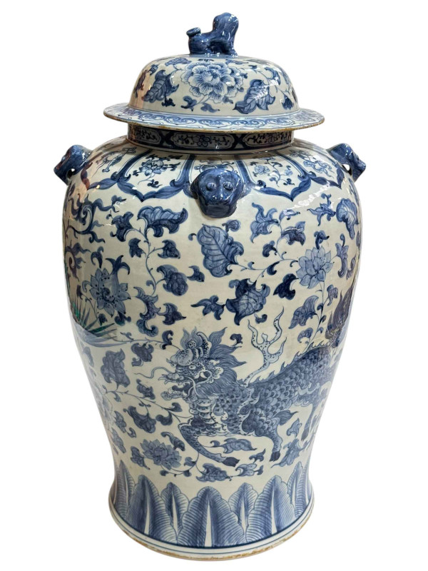 Large Chinese blue and white porcelain vase and cover decorated with Phoenix and Dragons, the lid mounted with dog of fo, 60cm.