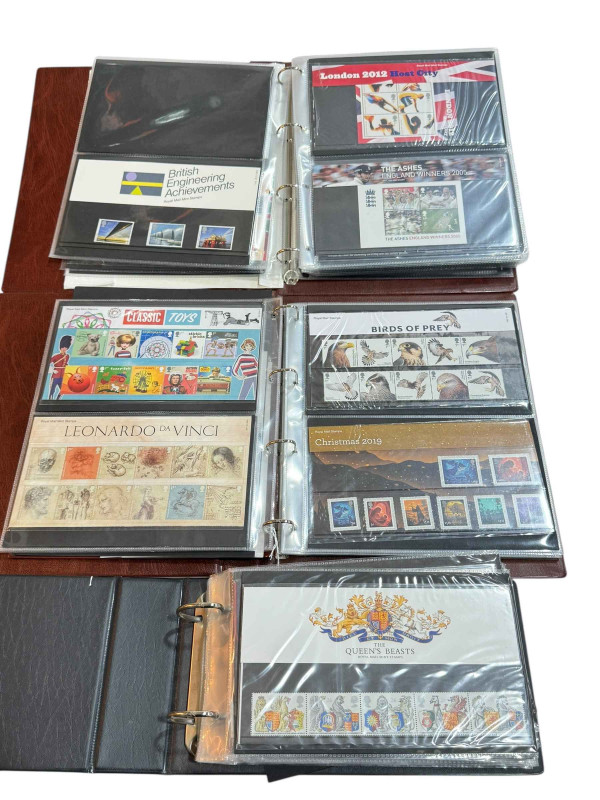 Three albums of stamps and first day covers.