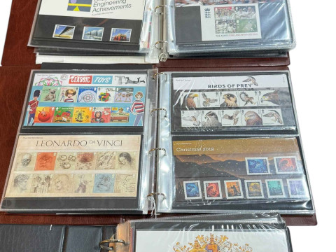 Three albums of stamps and first day covers.