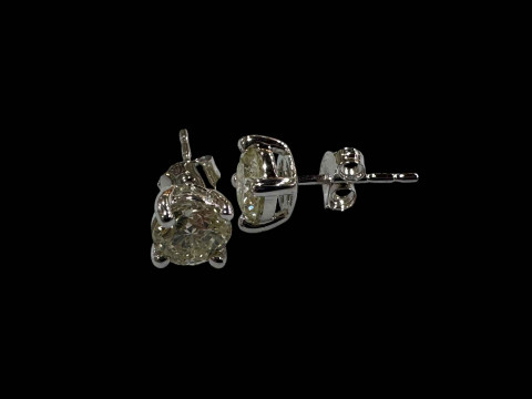 Pair of diamond stud earrings set in 18 carat white gold, diamonds totalling...