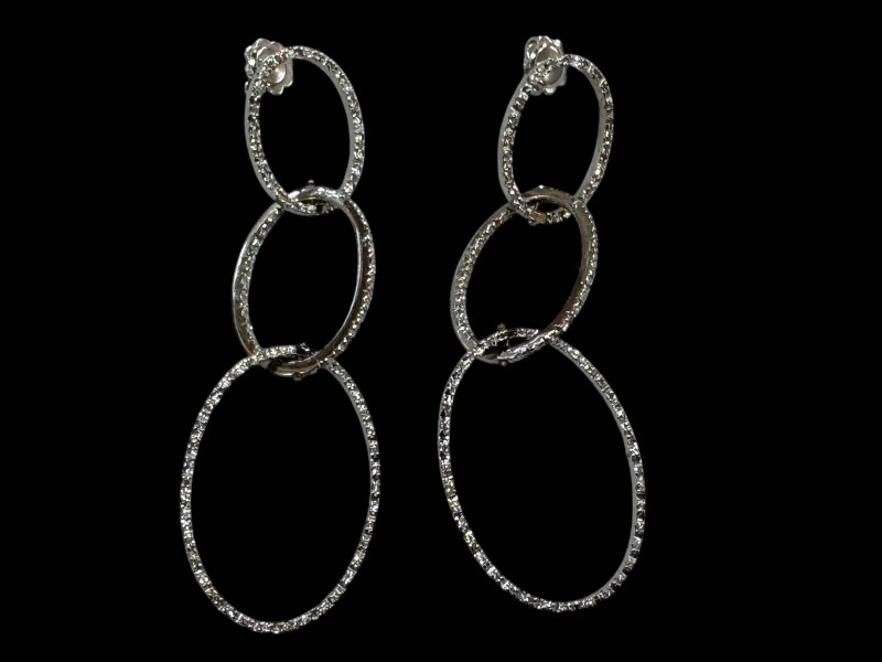 Pair of 18 carat white gold triple oval hoop design diamond earrings.