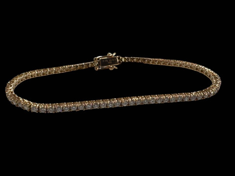 18 carat rose gold diamond tennis bracelet, the diamonds totalling over...