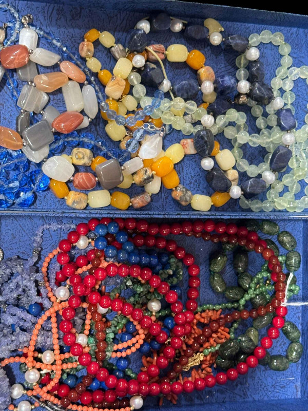 Collection of bead necklaces, some with gold clasps.