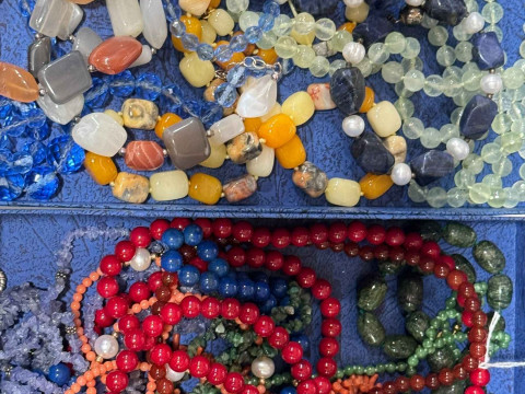 Collection of bead necklaces, some with gold clasps.