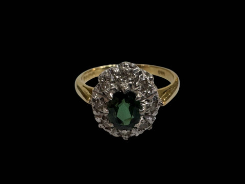 18 carat gold diamond and green stone cluster ring, size K/L.