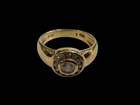 Diamond 18 carat gold ring having centre stone with twelve small stone...