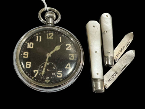 WWII GSTP pocket watch, and two silver and mother of pearl folding knives...