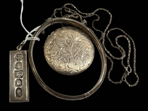 Silver ingot, bangle and locket (3).