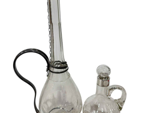 Silver mounted 'Whisky' jug, Sheffield 1900, and tall liquor jug with...