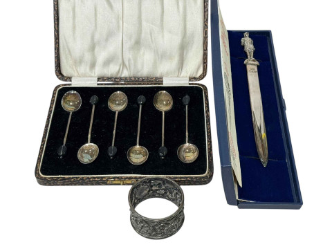 Royal Irish silver letter knife, napkin ring and cased coffee spoons (3).