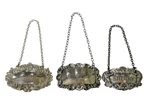 Three silver decanter labels, Brandy, Claret and Sherry.