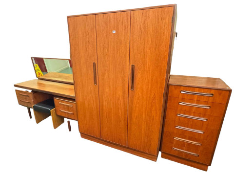 G Plan teak four piece bedroom suite comprising triple door wardrobe,...
